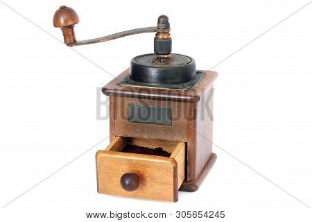 Manual Coffee Grinder On A White Background. Antiquary