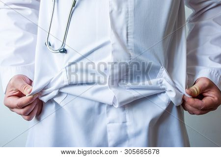 Doctor, Wearing White Lab Coat With Stethoscope Around His Neck, Showing Empty Robe Pockets  Without