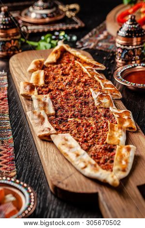 Traditional Turkish Cuisine. Turkish Pizza Pita With Meat. Turk Pidesi Or  Sucuk Pide. Beautiful Ser