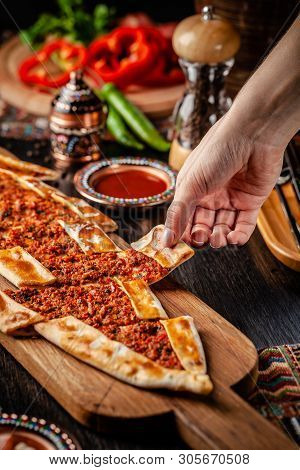 Traditional Turkish Cuisine. Turkish Pizza Pita With Meat. Turk Pidesi Or  Sucuk Pide. Beautiful Ser