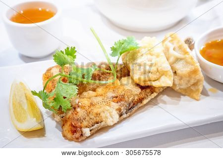 Delicious Dim Sum, Famous Cantonese Food In Asia - Fried Fish And Dumplings With Lemon, Sauce And Te