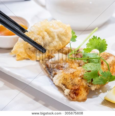 Delicious Dim Sum, Famous Cantonese Food In Asia - Fried Fish And Dumplings With Lemon, Sauce And Te