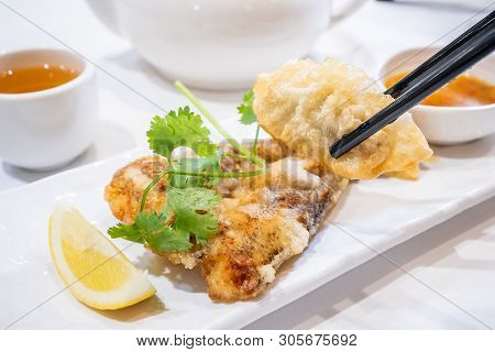 Delicious Dim Sum, Famous Cantonese Food In Asia - Fried Fish And Dumplings With Lemon, Sauce And Te