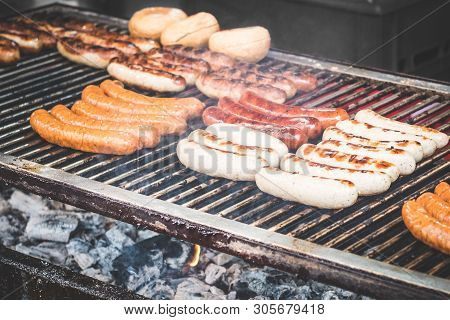 Suasages On Barbecue Grill - Grilling Sausage