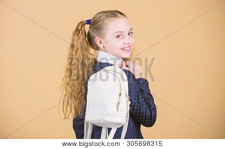 Carrying Things In Backpack. Schoolgirl Ponytails Hairstyle With Small Backpack. Learn How Fit Backp