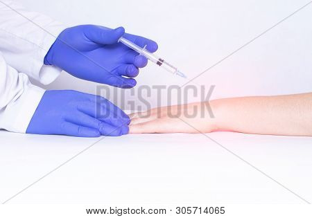 Doctor Injects Blockade Into Wrist Joint With Chondroprotector And Analgesic Drug, Close-up, Medical