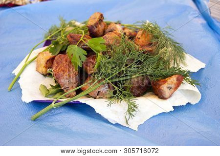 Chopped  Bbq Pieces Of  Mutton, Beef Or Chicken Meat On The Plate With Greenery Of Parsley And Dill