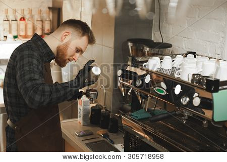 Weighing Coffee Grains On Digital Scale. Hands Of Male Barista Pouring Roasted Coffee Grains On A Pa