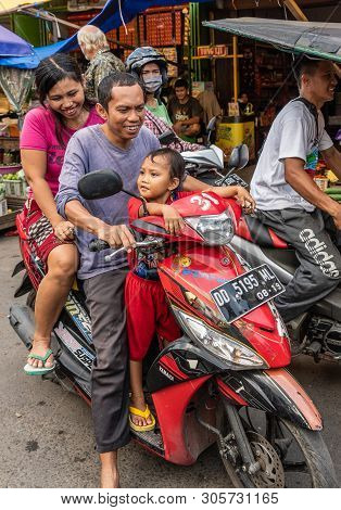 Makassar, Sulawesi, Indonesia - February 28, 2019: Terong Street Market. Family Of Three, Mother, Fa