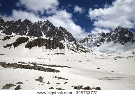 High Sunlit Rocks, Snowy Plateau With Stones And Cloudy Blue Sky In Sunny Spring Day. Turkey, Kachka