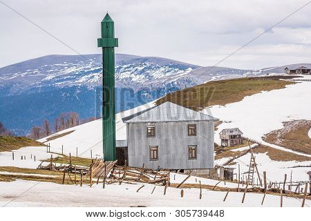 Goderdzi, Georgia - May 8, 2017. Georgian Mosque With Green Minaret In Mountains