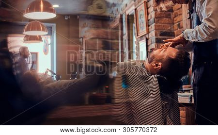 Attractive Relaxed Man Just Got Great Service From Talanted Trendy Barber.