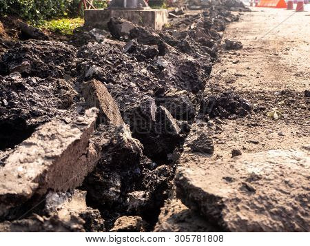 The Road Repairing Works With Jackhammer. Machine Drills Asphalt