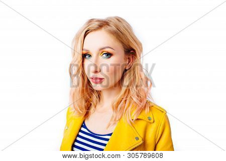 Young Blonde Girl With An Original Hairstyle And Bright Professional Makeup
