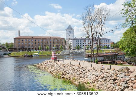 City Jelgava, Latvian Republic. River Lielupe, Peoples And Urban City View. Houses And Walking Paths