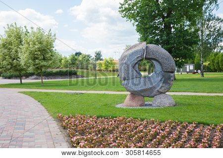 City Jelgava, Latvian Republic. City Park With Sculpture And Flowers. Walking Paths And Trees. Jun 9