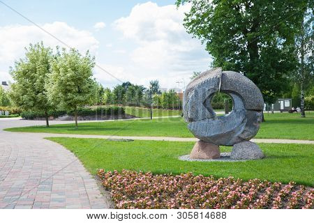 City Jelgava, Latvian Republic. City Park With Sculpture And Flowers. Walking Paths And Trees. Jun 9