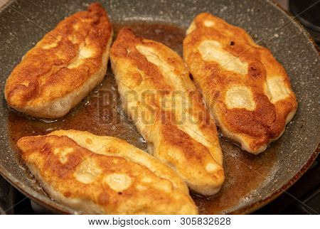 Patties Are Fried In Oil In A Pan .
