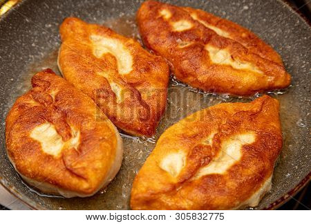 Patties Are Fried In Oil In A Pan .
