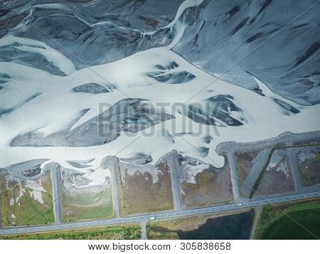 Long Snow Hills In Iceland With Road And Cars Top View