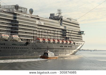 Ijmuiden, The Netherlands -june, 9th 2019: Nieuw Statendam Leaving Ijmuiden Sea Lock, Joined By Pilo