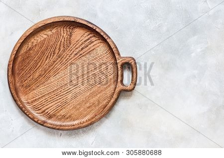 Empty Round Wooden Dish On Grey Concrete Background, Copy Space For Your Text
