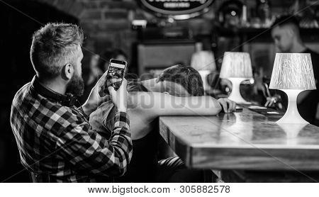 Hipster Making Fun Of Drunk Friend. Man Drunk Fall Asleep And Guy With Smartphone. Hipster Taking Ph