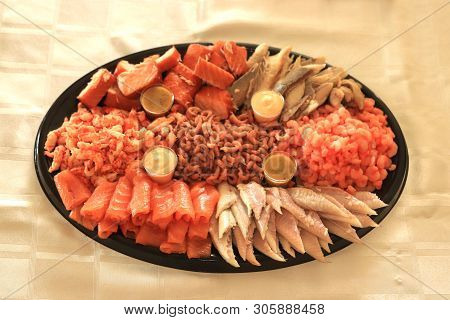 Serving Plate With Fresh Luxurious Seafood And Sauce