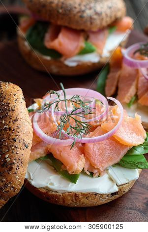 Lox - Everything Bagel With Smoked Salmon, Spinach, Red Onions, Avocado And Cream Cheese Over A Rust