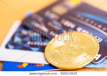Bitcoin Golden Coin And Visa Credit Cards. Virtual Cryptocurrency Concept. Buy And Sell Bitcoin By C