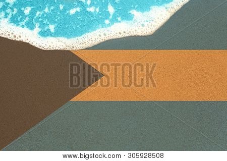 Sea Wave On Sandy Beach With Flag Bahamas. Top View On Surf.