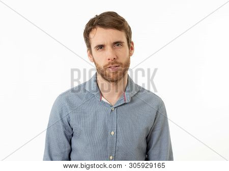 Portrait Of Young Bearded Man Looking With I New It Or I Told You So Attitude And Expression On His 