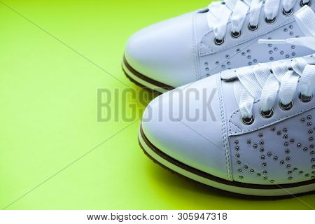 Fashionable New Women Sneakers With Laces.white Oxford Shoes Isolated On Yellow Background.leather W