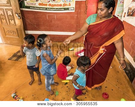 Puduchery, India - December Circa, 2018. Poor Preschool Teacher And Her Group Of Kids Boys Girls Hav