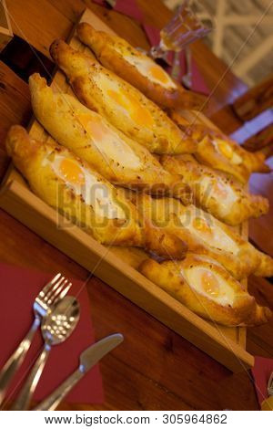 Adjar khachapuri during cooking, close up