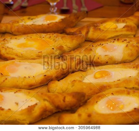 Adjar khachapuri during cooking, close up
