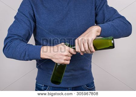 Cropped Close-up Photo Of Skilled Party Goer Showing His Talant In Opening Bottles Isolated Grey Bac