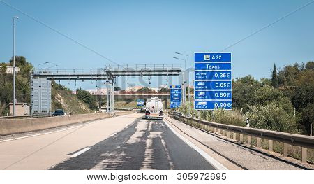 Truck Passing Under A Tollgate On The Highway In Faro - Portugal