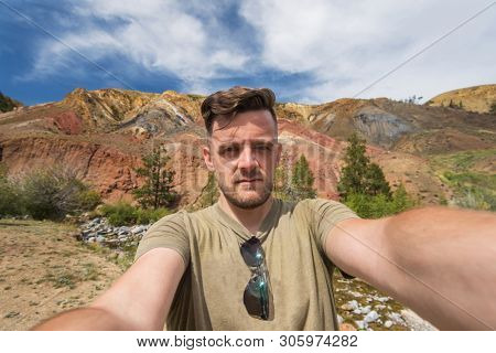 Selfie of man in Valley of Mars landscapes in the Altai Mountains, Kyzyl Chin, Siberia, Russia