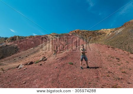 Man in Valley of Mars landscapes in the Altai Mountains,