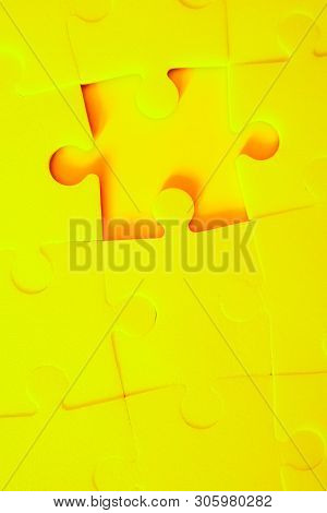 Multiple Yellow Puzzle Pieces Put Together Without One Piece. View From Above. Close Up Trendy Monoc