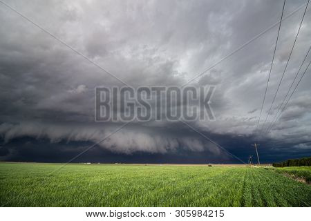 A Low Shelf Cloud And Severe Storm Rapidly Approaches Over Farm Country.