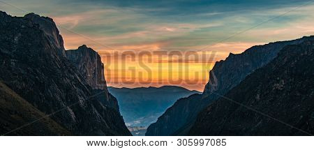Sun Hiding Behind A Mountain Seen Through A Valley