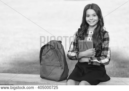 For Mind That Is Eager To Learn. Happy Kid Hold Book Sitting On Bench. School Library. Lending Libra