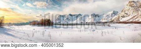 Panoramic Winter Scenery With Frozen Fjord On Vestvagoy Island At Sunset With Snowy  Mountain Peaks 