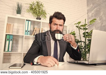 Comfy Workspace. Bearded Hipster Formal Suit Relaxing With Coffee. Office Life Is Unthinkable Withou