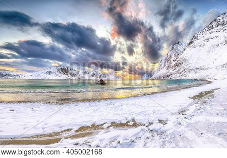 Fantastic Winter View Of Haukland Beach During Sunset With Lots Of Snow  And Snowy  Mountain Peaks N