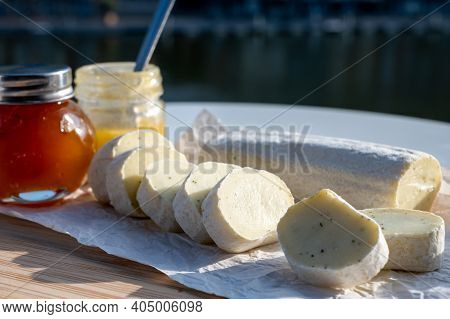 Belgian Abbey Cheese Fagotin In Pieces With Jam Served Outdoor With View On Maas River And Center Of