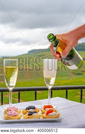 Tasting Of French Sparkling White Wine With Bubbles Champagne On Outdoor Terrace With View On Green 