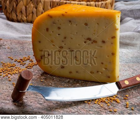 Cheese Collection, Piece Of Hard Yellow Dutch Gouda Cheese With Dried Fenugreek Seeds